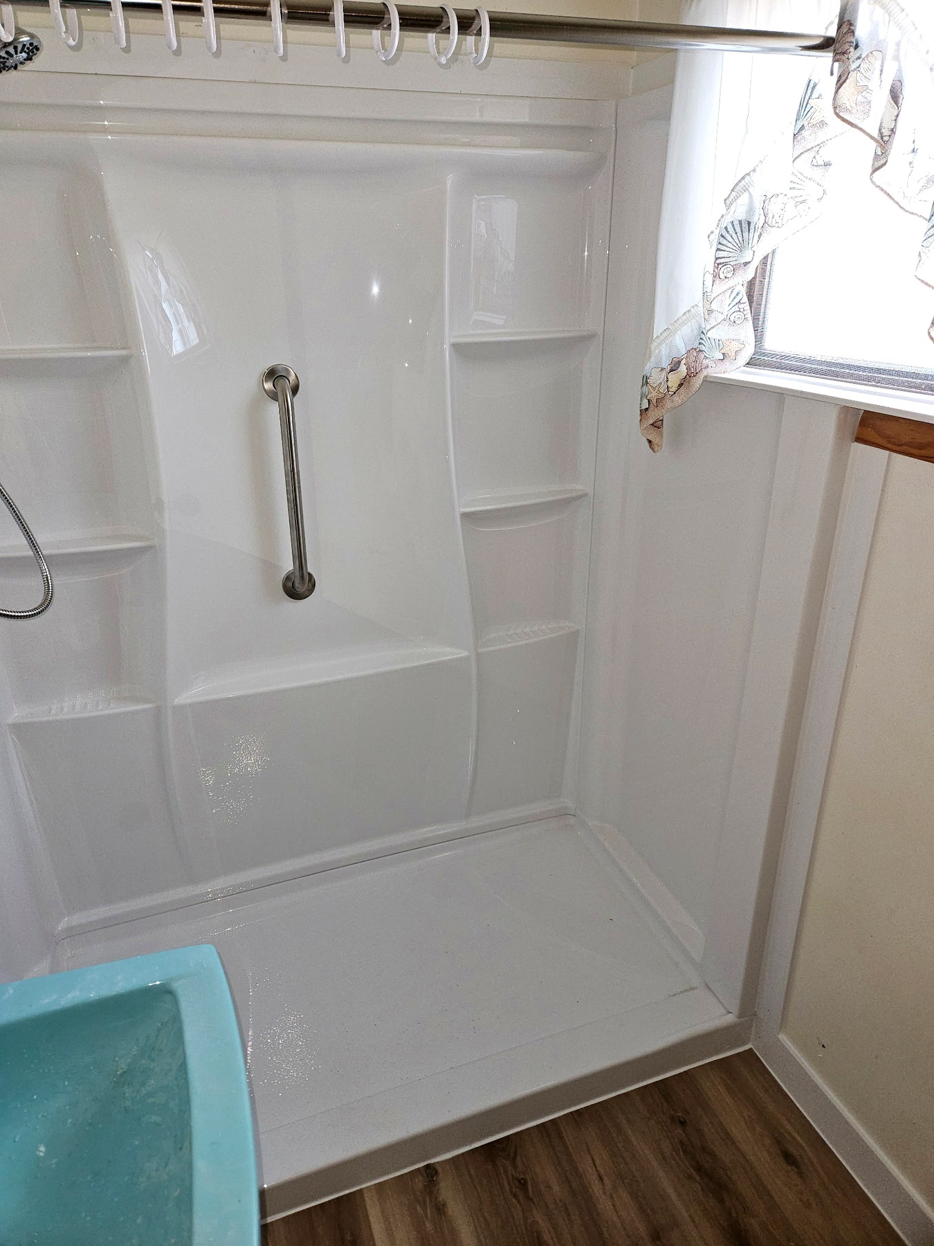 Completed accessible Delta shower with grab bar