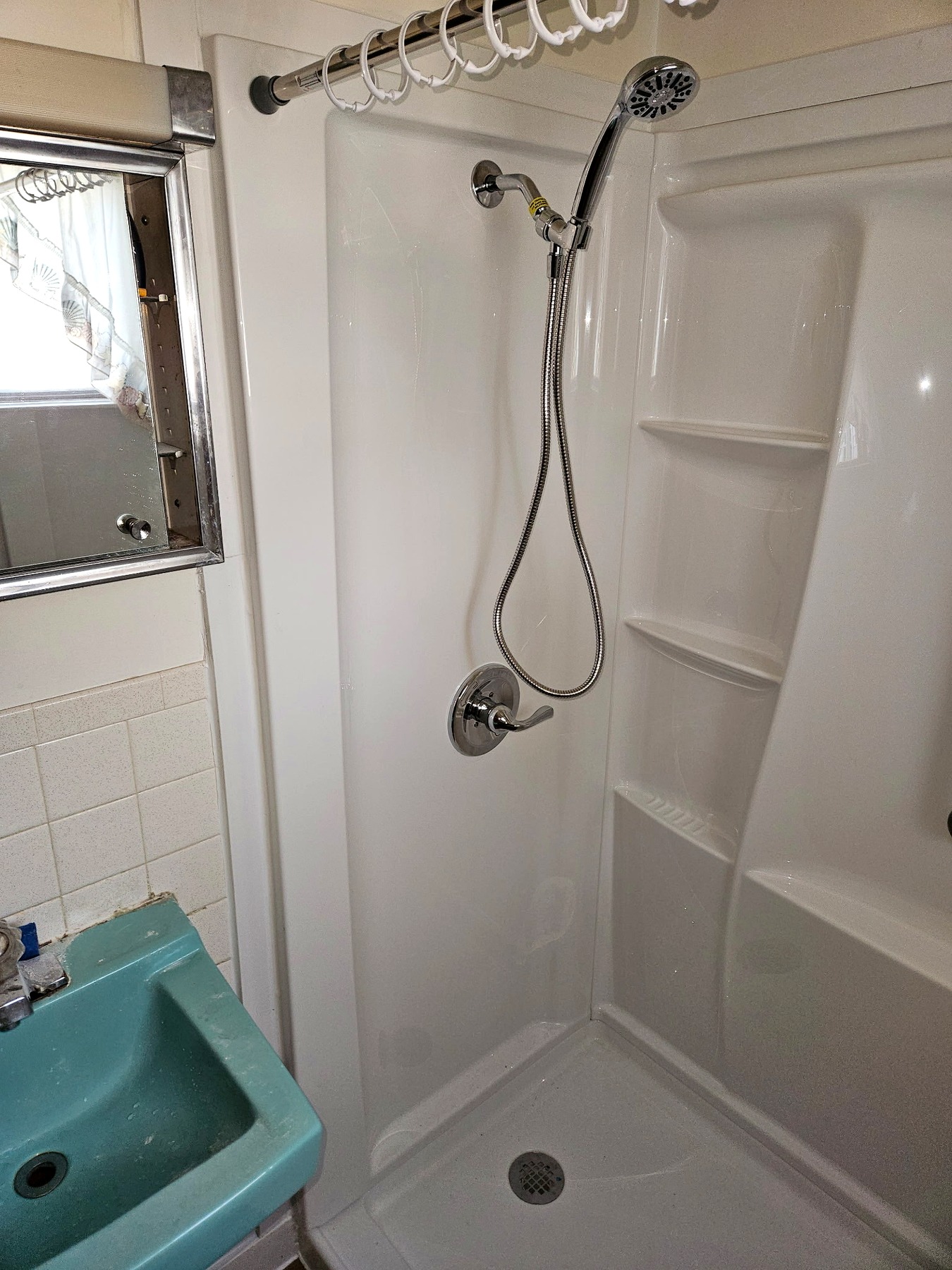Completed Delta shower with handheld showerhead