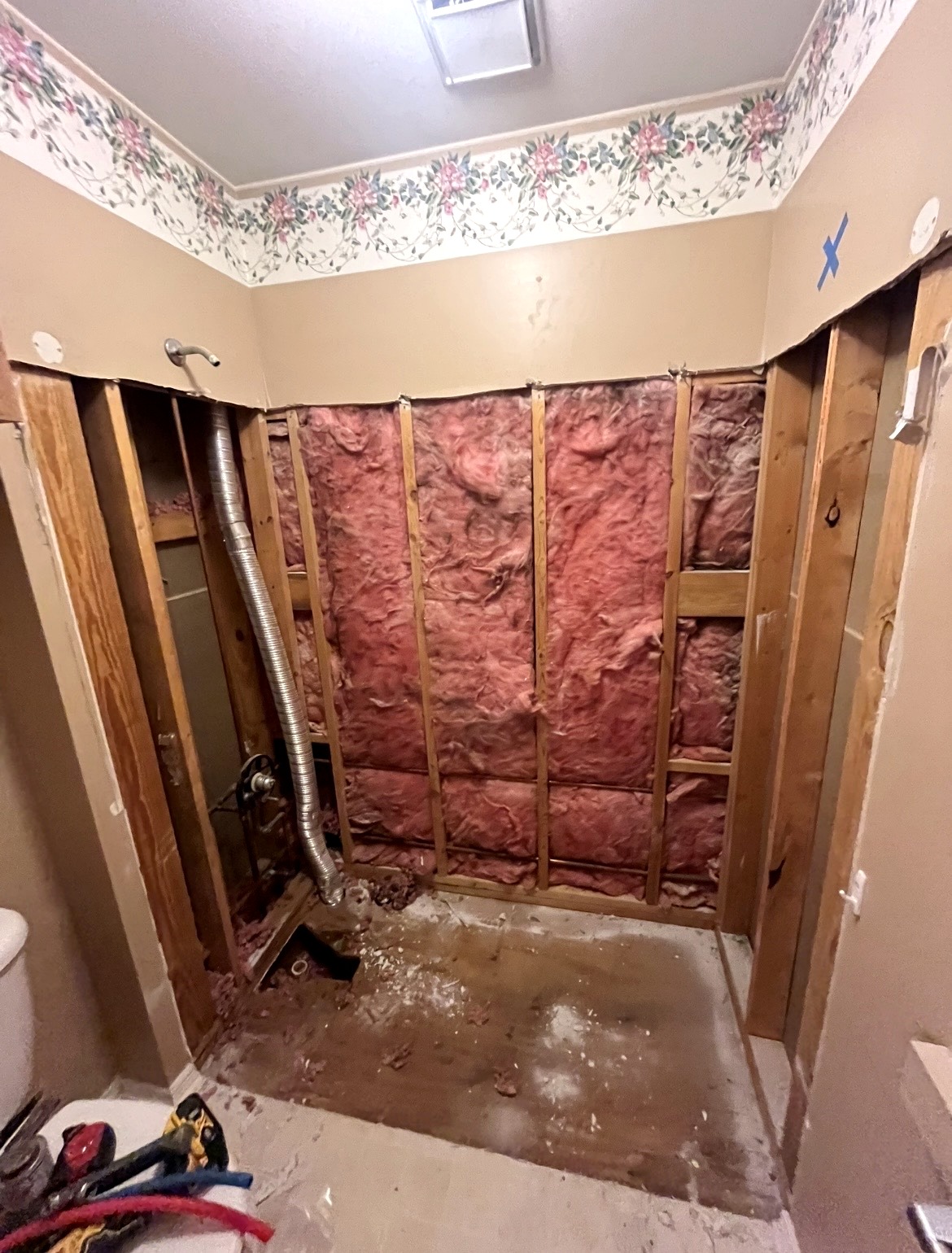 Bathroom demolition and shower installation in progress