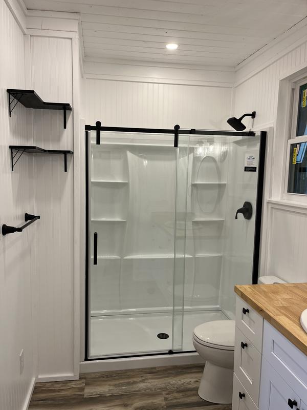 White shower with black glass door