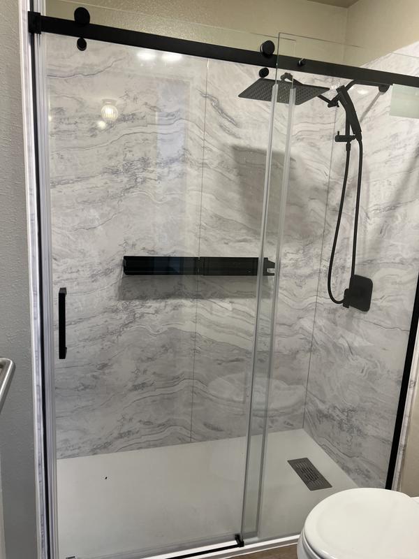 Stone-look shower with black fixtures